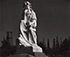 Ansel Adams (1902 - 1984)<br><em>Cemetery Statue and Oil Derricks, Long Beach, California</em>, 1939</br>Gelatin silver print<br>Image: 15 1/4 x 18 3/8"; Mount: 23 x 28 7/8"