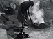 <em>Rose Gonzalez Firing Pottery</em>, 1946<br>Gelatin silver print</br>Image: 9 3/4 x 7 5/8”; Paper: 9 7/8 x 8”; Mount:  14 x 17”