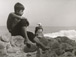 <em>Untitled (Boy sitting on rock with seabird),</em>c. 1950s/1960s<br />Gelatin silver print<br />Image: 12 x 9"