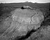 Judy Dater (b. 1941)<br><em>Self Portrait, Badlands</em>, 1981</br>Gelatin silver print<br>Image: 14 1/2 x 18 1/2"; Paper: 16 x 20"